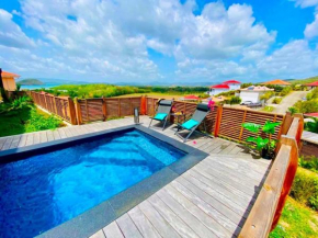 Villa Passion Cannelle de standing avec sa piscine vue mer